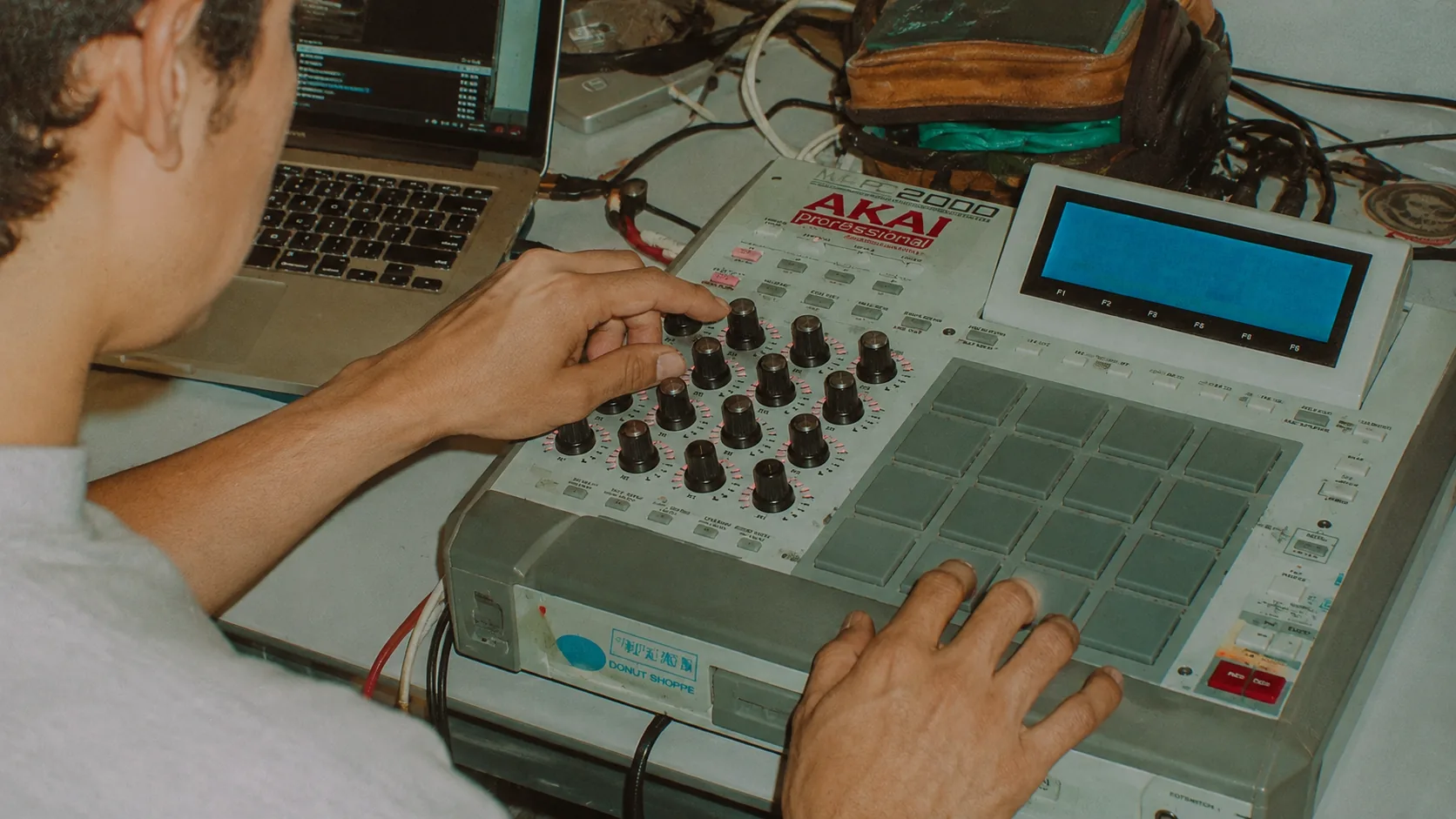 Music producer working at a sampler